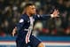 PARIS, FRANCE - FEBRUARY 09: Kylian Mbappe of Paris Saint-Germain celebrates after scoring his team's second goal during the Ligue 1 match between Paris Saint-Germain and Olympique Lyon at Parc des Princes on February 09, 2020 in Paris, France. (Photo by