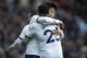 BIRMINGHAM, ENGLAND - FEBRUARY 16: Son Heung-Min of Tottenham Hotspur celebrates with team mate Steven Bergwijn after scoring the winning goal during the Premier League match between Aston Villa and Tottenham Hotspur at Villa Park on February 16, 2020 in
