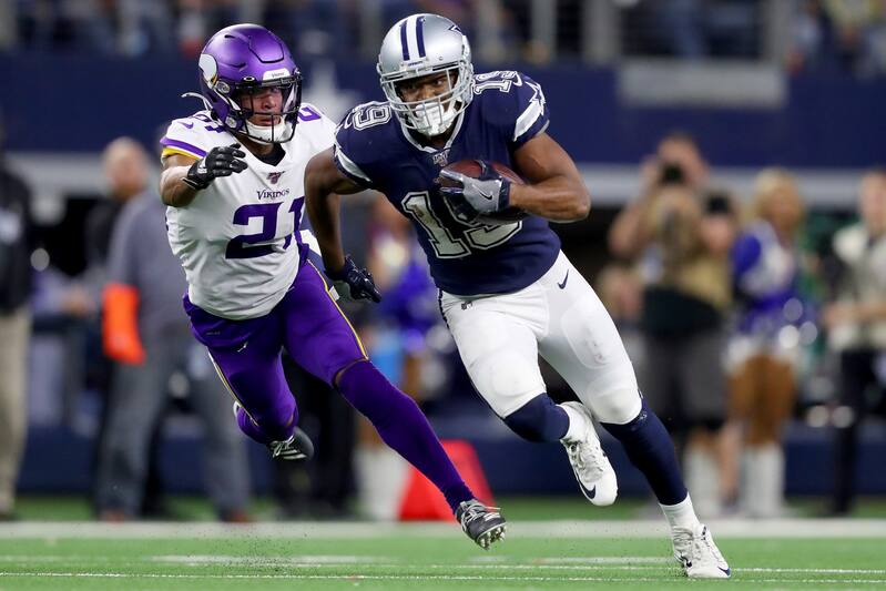 ARLINGTON, TEXAS - NOVEMBER 10: Amari Cooper #19 of the Dallas Cowboys carries the ball against Mike Hughes #21 of the Minnesota Vikings in the fourth quarter at AT&T Stadium on November 10, 2019 in Arlington, Texas. (Photo by Tom Pennington/Getty Images)