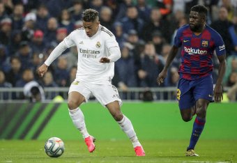MADRID, SPAIN - MARCH 1: (L-R) Mariano of Real Madrid, Samuel Umtiti of FC Barcelona during the La Liga Santander  match between Real Madrid v FC Barcelona at the Santiago Bernabeu on March 1, 2020 in Madrid Spain (Photo by David S. Bustamante/Soccrates/G
