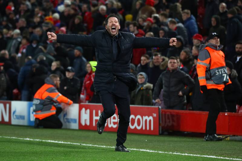 LIVERPOOL, ENGLAND - MARCH 11: Diego Simeone, Manager of Atletico Madrid celebrates his sides third goal during the UEFA Champions League round of 16 second leg match between Liverpool FC and Atletico Madrid at Anfield on March 11, 2020 in Liverpool, Unit