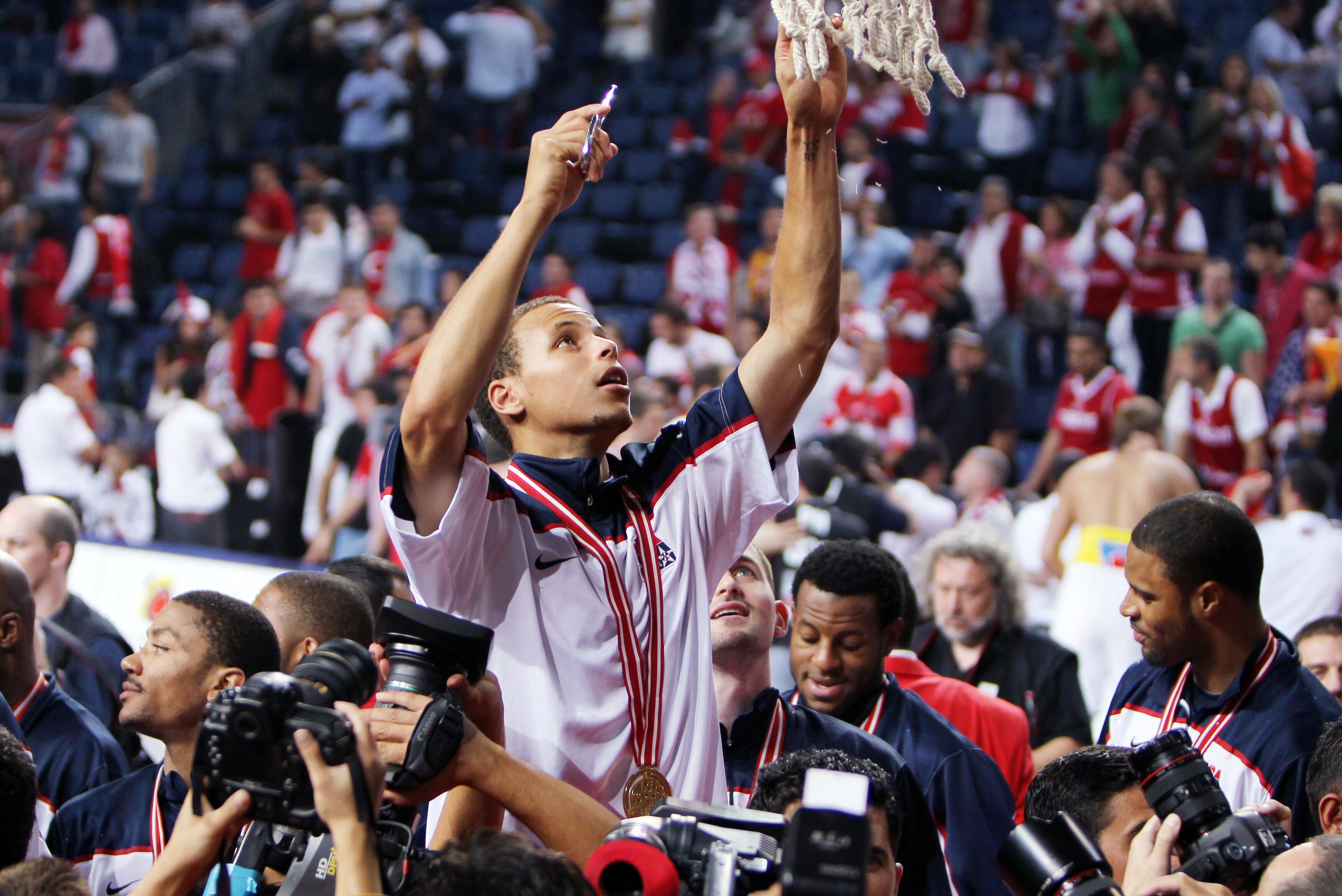 ISTANBUL - SEPTEMBER 12: Stephen Curry #11 of the USA celebrate cutting the net of the basket following win in the final game against Turkey during the 2010 Basketball World Championships on September 12, 2010 in Istanbul, Turkey. (Photo by Roman Kruchini