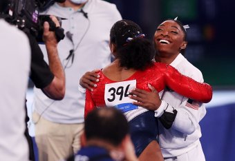 TOKYO, JAPAN - JULY 27: Simone Biles hugs teammate Jordan Chiles of Team United States during the Women's Team Final on day four of the Tokyo 2020 Olympic Games at Ariake Gymnastics Centre on July 27, 2021 in Tokyo, Japan. (Photo by Ezra Shaw/Getty Images