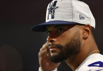 GLENDALE, ARIZONA - AUGUST 13: Quarterback Dak Prescott #4 of the Dallas Cowboys watches from the sidelines during the first half of the NFL preseason game against the Arizona Cardinals at State Farm Stadium on August 13, 2021 in Glendale, Arizona. The Ca