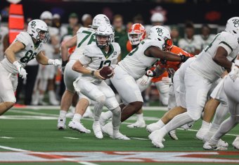 ARLINGTON, TX - DECEMBER 04: Baylor Bears quarterback Blake Shapen (12) hands the ball off in the Big 12 Championship Game between the Baylor Bears and the Oklahoma State Cowboys on December 4th, 2021 at AT&T Stadium in Arlington, TX. (Photo by John Bunch ARLINGTON, TX - DECEMBER 04: Baylor Bears quarterback Blake Shapen (12) hands the ball off in the Big 12 Championship Game between the Baylor Bears and the Oklahoma State Cowboys on December 4th, 2021 at AT&T Stadium in Arlington, TX. (Photo by John Bunch