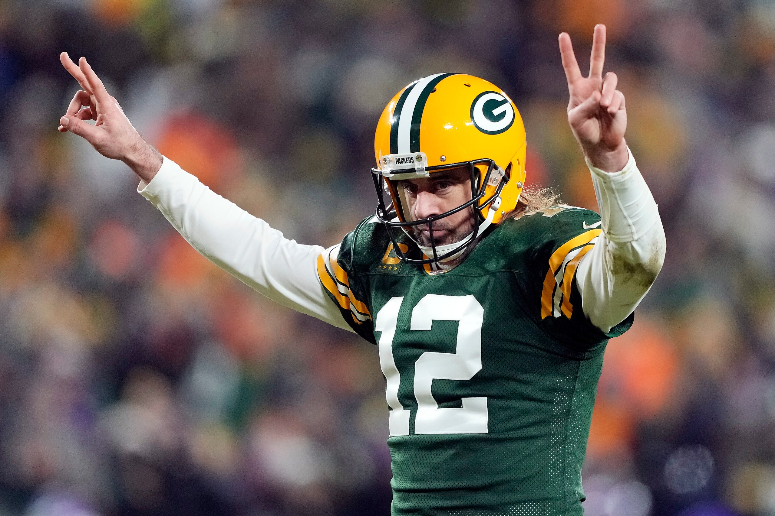 GREEN BAY, WISCONSIN - JANUARY 02:  Quarterback Aaron Rodgers #12 of the Green Bay Packers celebrates after a touchdown during the 3rd quarter of the game against the Minnesota Vikings at Lambeau Field on January 02, 2022 in Green Bay, Wisconsin. (Photo b