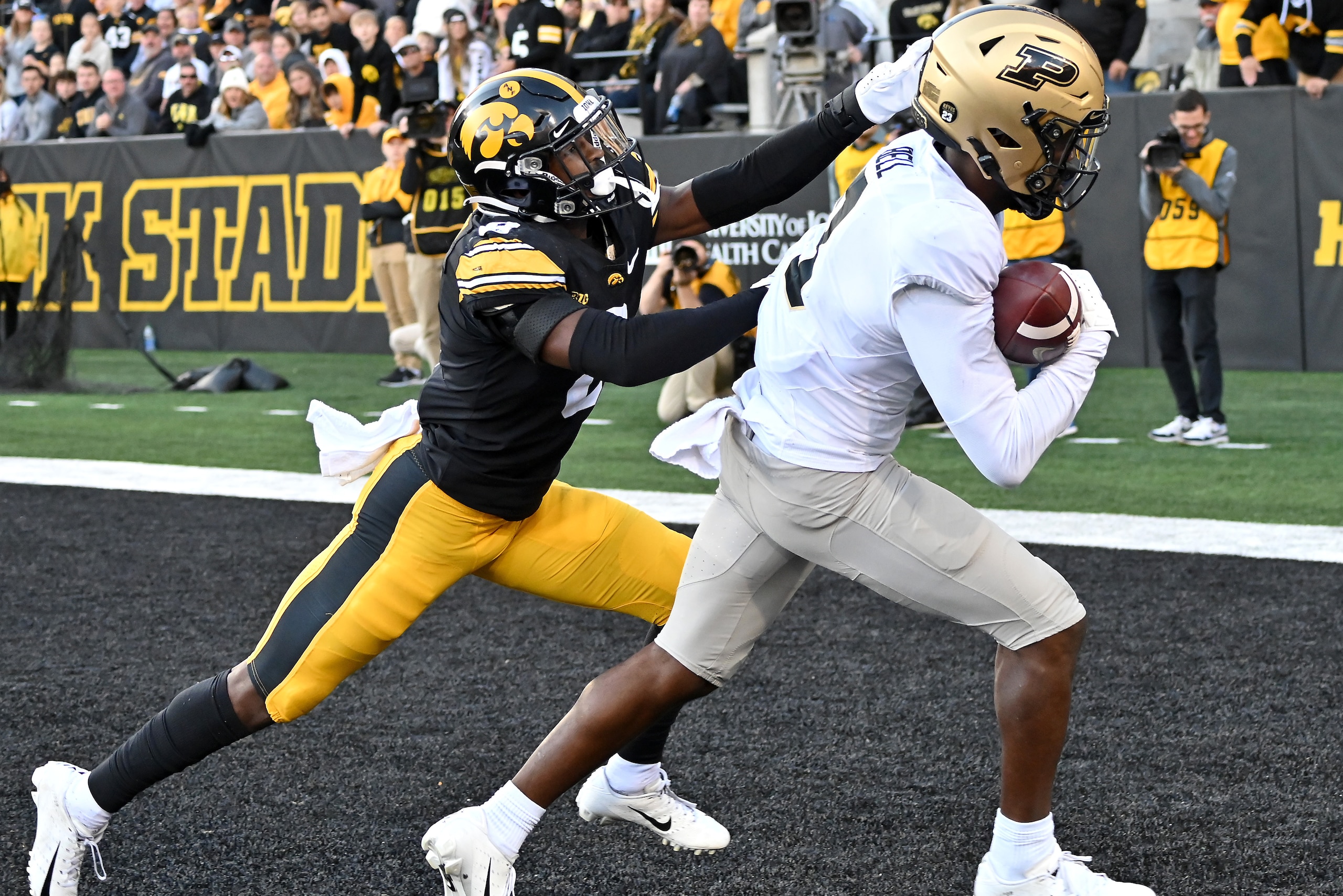 IOWA CITY, IA - OCTOBER 16: Purdue wide receiver David Bell (3) scores after catching a pass in the fourth quarter during a college football game between the Purdue University  Boilermakers and the University of Iowa Hawkeyes on October 16, 2021, at Kinni