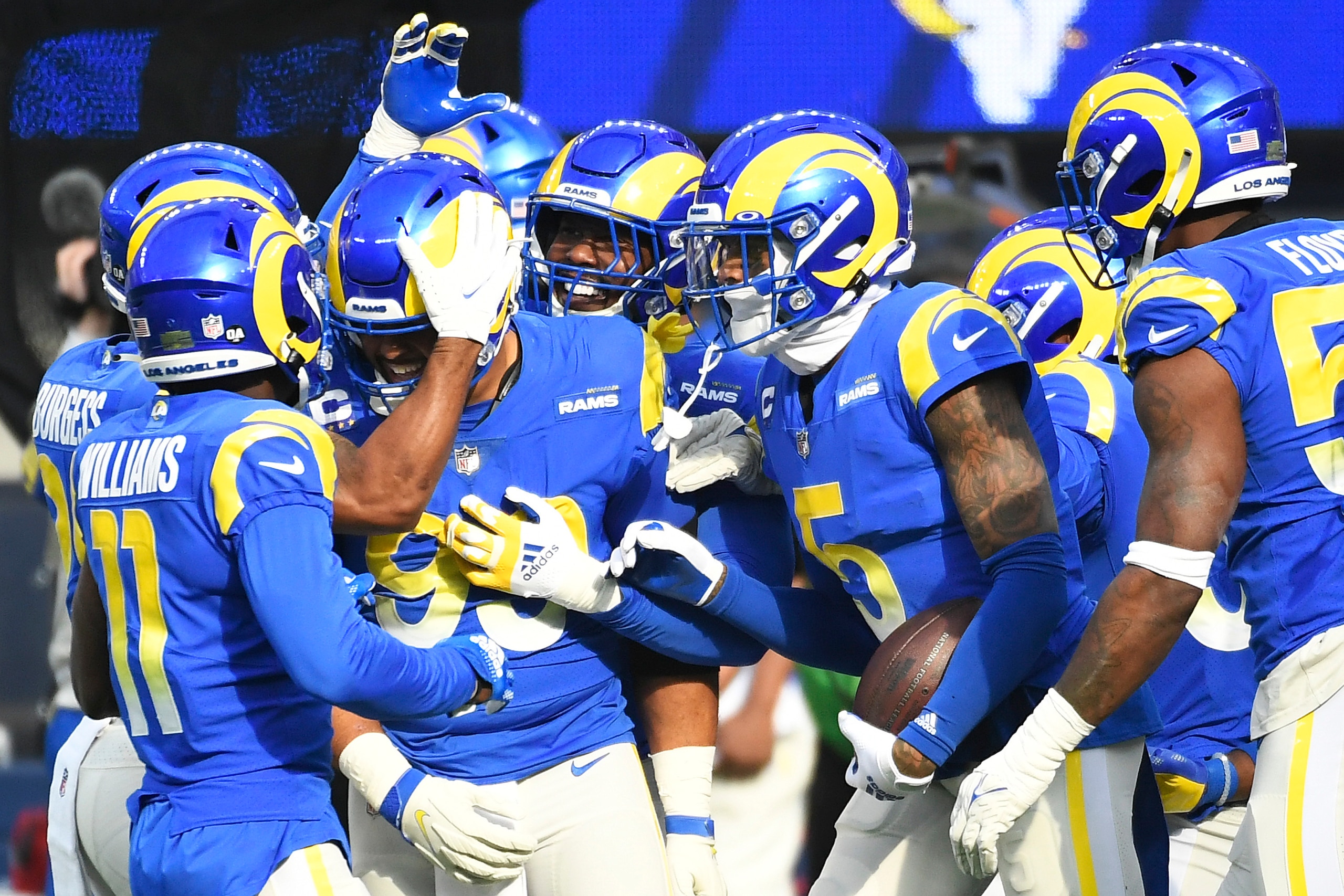 INGLEWOOD, CALIFORNIA - DECEMBER 05: Aaron Donald #99 of the Los Angeles Rams celebrates his forced fumbles recovered by Jalen Ramsey #5 of the Los Angeles Rams, against the Jacksonville Jaguars with teammates during the first quarter at SoFi Stadium on D