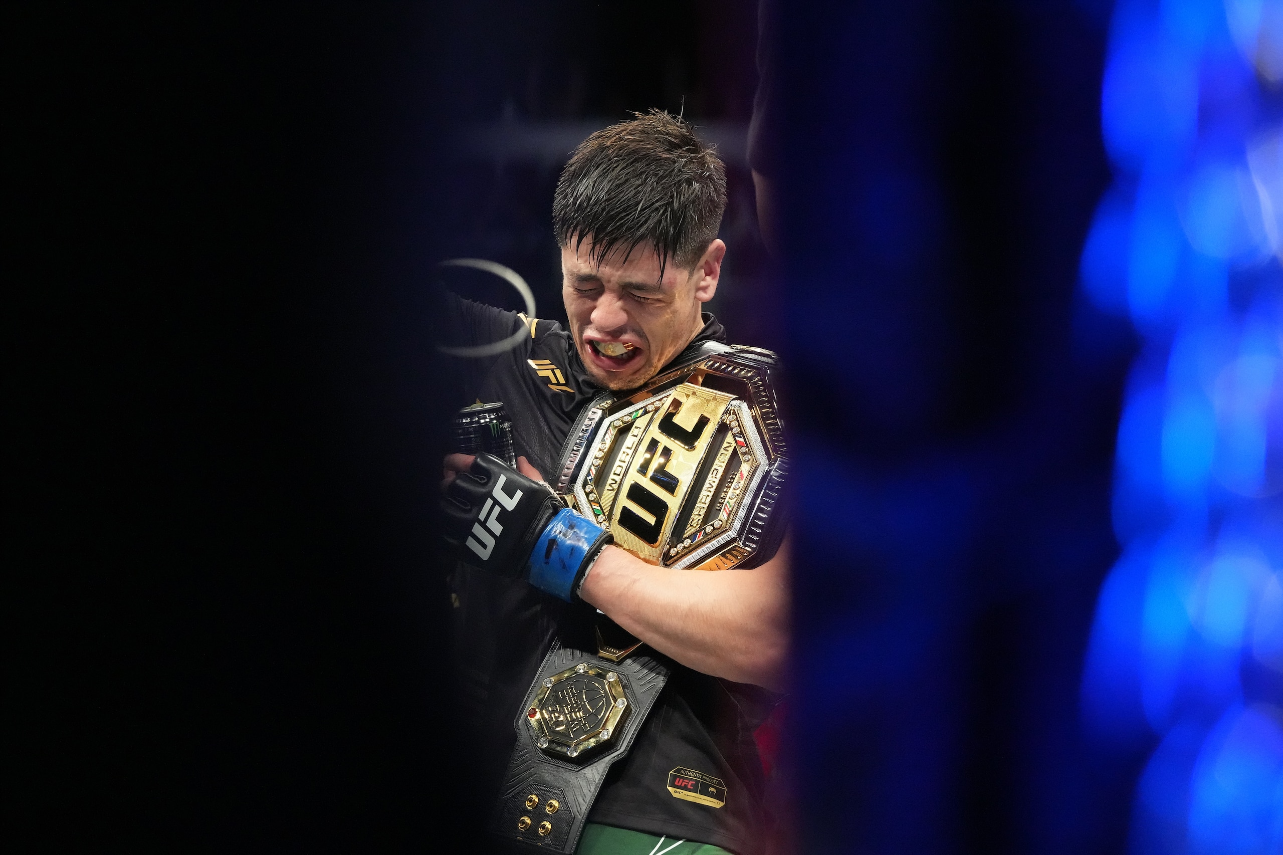 GLENDALE, AZ - JUNE 12:  Brandon Moreno (blue gloves) is declared the winner during UFC 263 on June 12, 2021, at Gila River Arena in Glendale, AZ. (Photo by Louis Grasse/PxImages/Icon Sportswire via Getty Images)