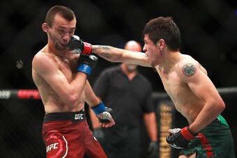 MEXICO CITY, MEXICO - SEPTEMBER 21: Brandon Moreno of Mexico punches Askar Askarov of Russia in their flyweight bout during UFC Fight Night event at Arena Ciudad de Mexico on September 21, 2019 in Mexico City, Mexico. (Photo by Hector Vivas/Zuffa LLC/Zuf MEXICO CITY, MEXICO - SEPTEMBER 21: Brandon Moreno of Mexico punches Askar Askarov of Russia in their flyweight bout during UFC Fight Night event at Arena Ciudad de Mexico on September 21, 2019 in Mexico City, Mexico. (Photo by Hector Vivas/Zuffa LLC/Zuf