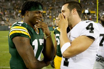 GREEN BAY, WI - AUGUST 18:  Davante Adams #17 of the Green Bay Packers and Derek Carr #4 of the Oakland Raiders chat after the preseason game at Lambeau Field on August 18, 2016 in Green Bay, Wisconsin. (Photo by Dylan Buell/Getty Images)