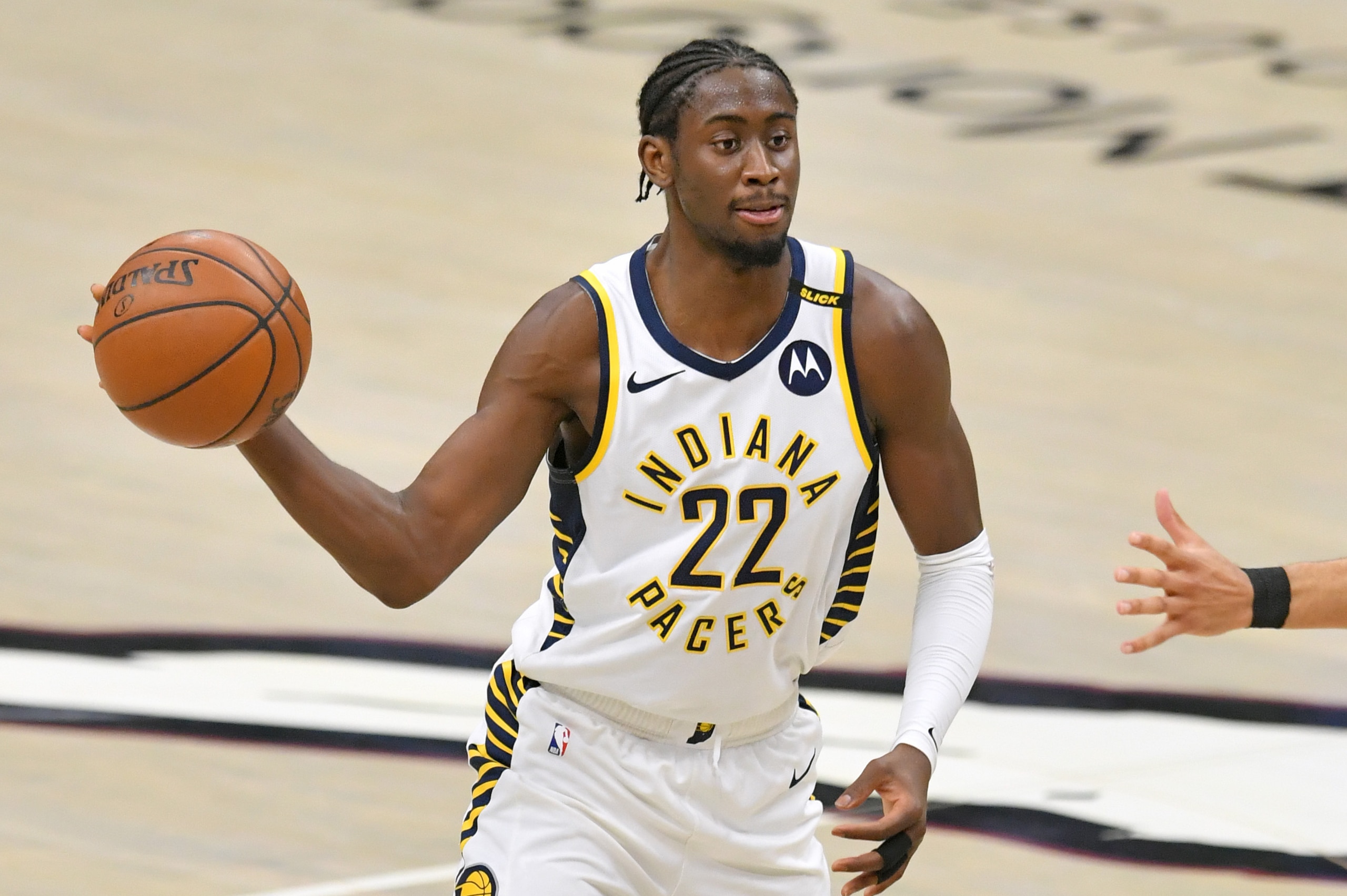 CLEVELAND, OHIO - MAY 10: Caris LeVert #22 of the Indiana Pacers passes during the second half against the Cleveland Cavaliers at Rocket Mortgage Fieldhouse on May 10, 2021 in Cleveland, Ohio. NOTE TO USER: User expressly acknowledges and agrees that, by CLEVELAND, OHIO - MAY 10: Caris LeVert #22 of the Indiana Pacers passes during the second half against the Cleveland Cavaliers at Rocket Mortgage Fieldhouse on May 10, 2021 in Cleveland, Ohio. NOTE TO USER: User expressly acknowledges and agrees that, by