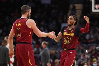 CLEVELAND, OH - DECEMBER 26: Darius Garland #10 and Kevin Love #0 of the Cleveland Cavaliers high five during the game against the Toronto Raptors on December 26, 2021 at Rocket Mortgage FieldHouse in Cleveland, Ohio. NOTE TO USER: User expressly acknowle
