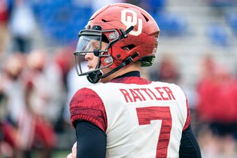 LAWRENCE, KS - OCTOBER 23: Spencer Rattler #7 of the Oklahoma Sooners warms up before the game against the Kansas Jayhawks at David Booth Kansas Memorial Stadium on October 23, 2021 in Lawrence, Kansas. (Photo by Kyle Rivas/Getty Images)