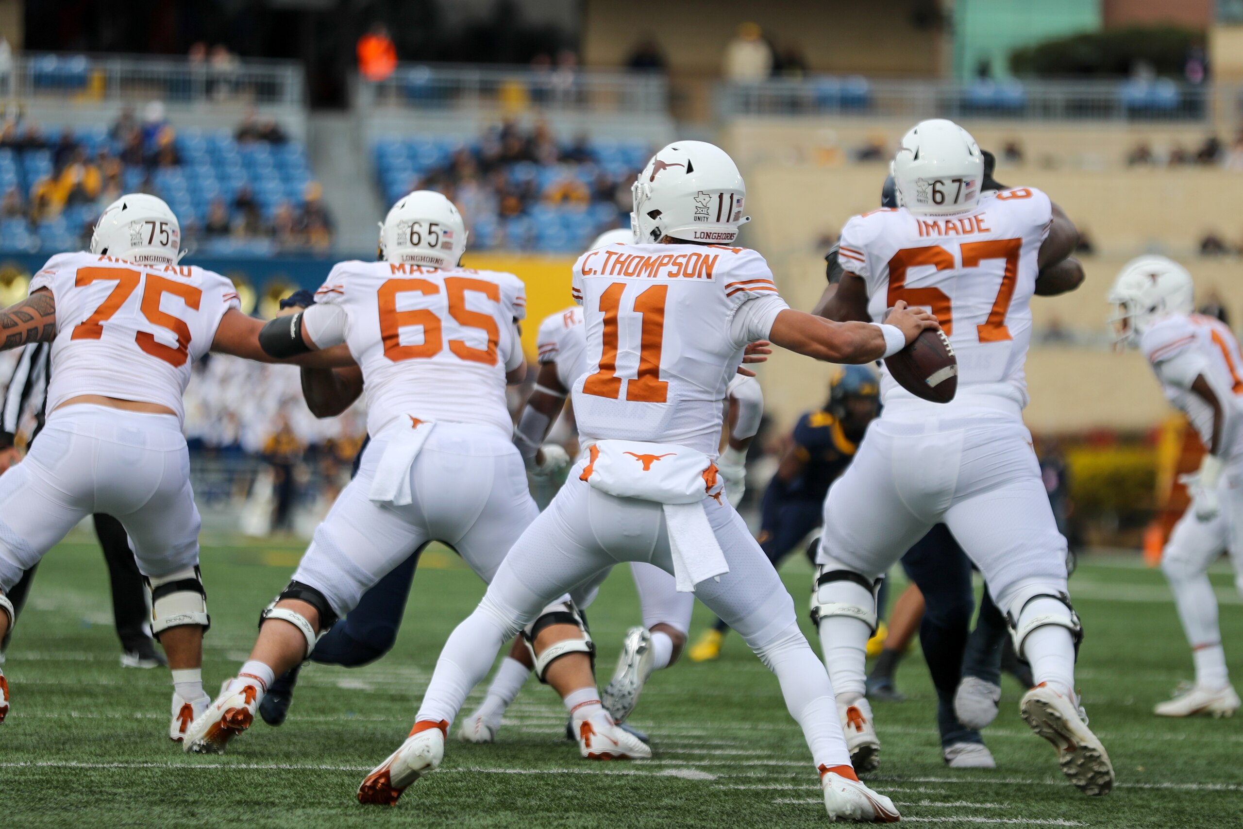 MORGANTOWN, WV - NOVEMBER 20: Texas Longhorns quarterback Casey Thompson (11) throws a pass during the college football game between the Texas Longhorns and the West Virginia Mountaineers on November 20, 2021, at Mountaineer Field at Milan Puskar Stadium
