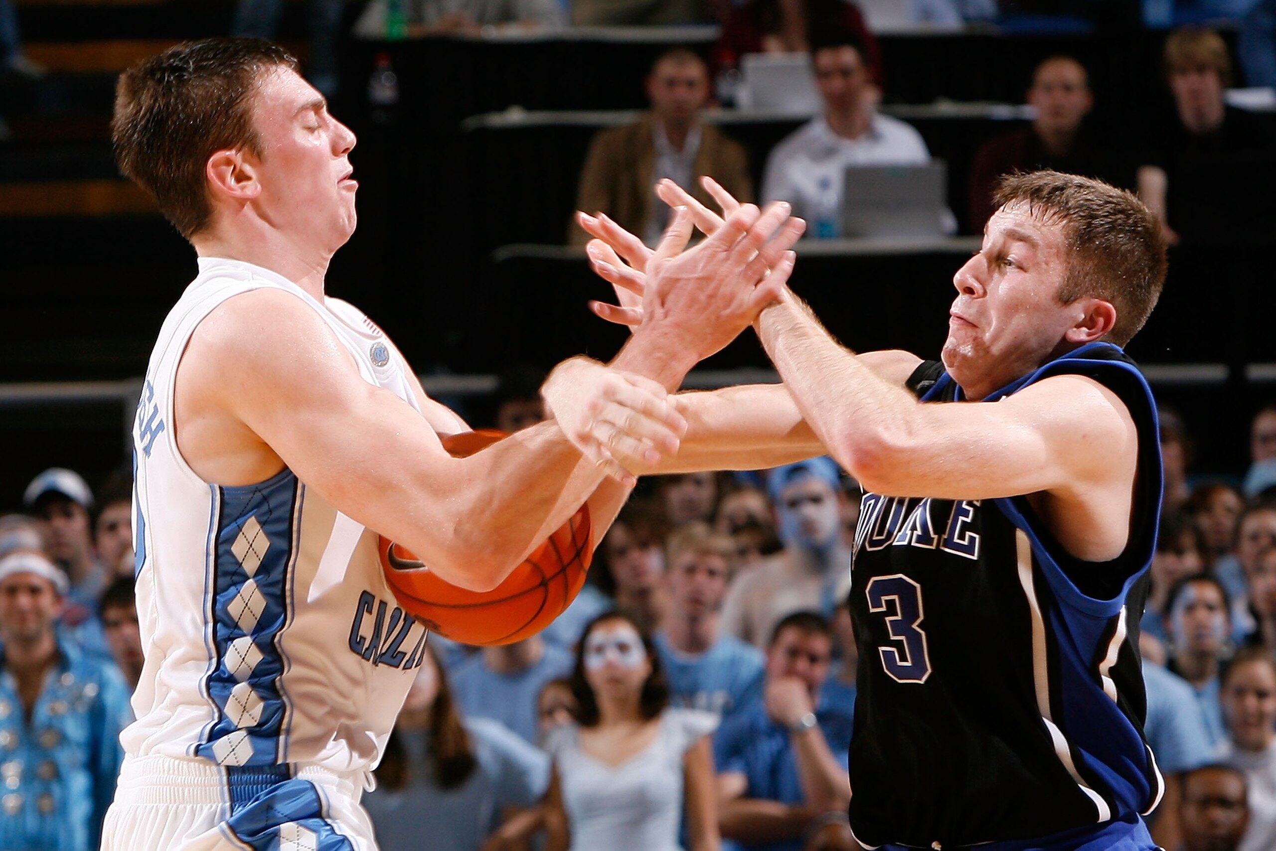 CHAPEL HILL, NC - FEBRUARY 06:  Tyler Hansbrough #50 of the North Carolina Tar Heels attempts a steal against Greg Paulus #3 of the Duke Blue Devils in the final seconds of the second half at the Dean E. Smith Center on February 6, 2008 in Chapel Hill, No