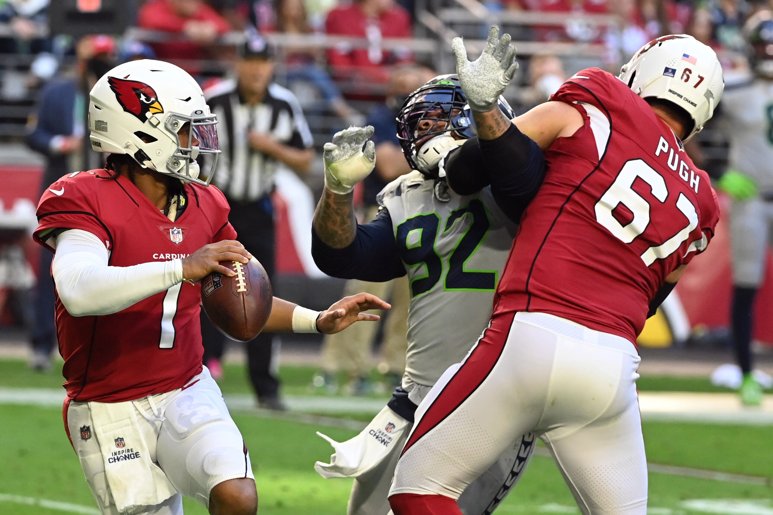 GLENDALE, ARIZONA - JANUARY 09: Robert Nkemdiche #92 of the Seattle Seahawks attempts to tackle Kyler Murray #1 of the Arizona Cardinals while being blocked by Justin Pugh #67 at State Farm Stadium on January 09, 2022 in Glendale, Arizona. (Photo by Norm GLENDALE, ARIZONA - JANUARY 09: Robert Nkemdiche #92 of the Seattle Seahawks attempts to tackle Kyler Murray #1 of the Arizona Cardinals while being blocked by Justin Pugh #67 at State Farm Stadium on January 09, 2022 in Glendale, Arizona. (Photo by Norm