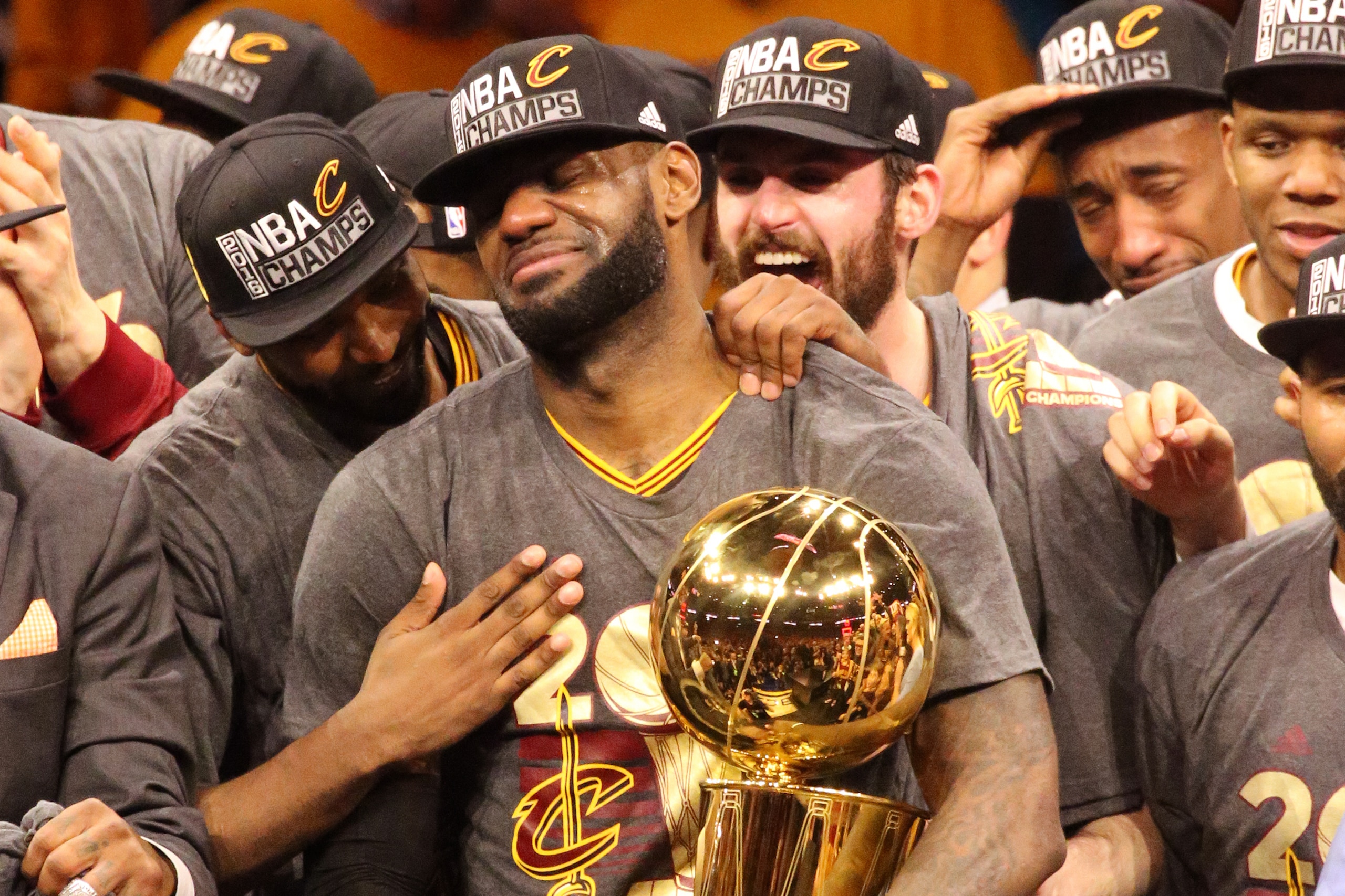 OAKLAND, CA - JUNE 19:  LeBron James #23 of the Cleveland Cavaliers holds up the Larry O'Brien Trophy after the 2016 NBA Finals Game Seven against the Golden State Warriors on June 19, 2016 at ORACLE Arena in Oakland, California. NOTE TO USER: User expres