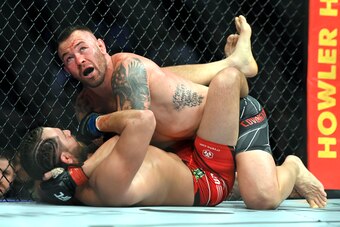 LAS VEGAS, NEVADA - MARCH 05:  Colby Covington (top) looks to the referee during his welterweight fight with Jorge Masvidal during UFC 272 at T-Mobile Arena on March 05, 2022 in Las Vegas, Nevada. (Photo by David Becker/Getty Images)