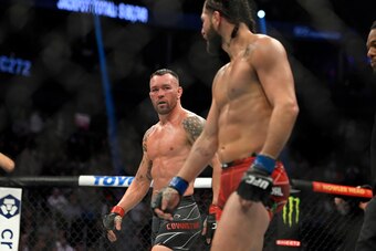 LAS VEGAS, NEVADA - MARCH 05: Colby Covington (L) and Jorge Masvidal stared down each other between rounds in their welterweight fight during UFC 272 at T-Mobile Arena on March 05, 2022 in Las Vegas, Nevada. (Photo by David Becker/Getty Images)