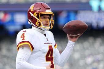 EAST RUTHERFORD, NEW JERSEY - JANUARY 09: Taylor Heinicke #4 of the Washington Football Team warms up before the game against the New York Giants at MetLife Stadium on January 09, 2022 in East Rutherford, New Jersey. (Photo by Dustin Satloff/Getty Images)