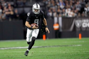 LAS VEGAS, NEVADA - JANUARY 09: Quarterback Marcus Mariota #8 of the Las Vegas Raiders runs with the ball during a game against the Los Angeles Chargers at Allegiant Stadium on January 09, 2022 in Las Vegas, Nevada. (Photo by Steve Marcus/Getty Images)