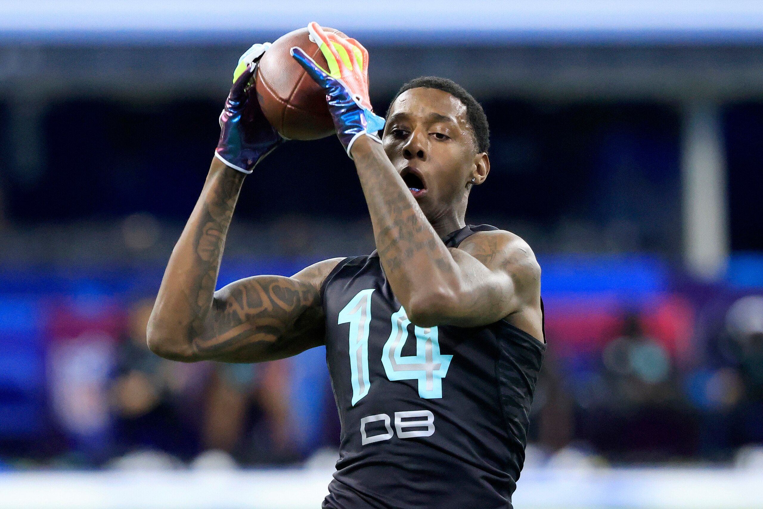 INDIANAPOLIS, INDIANA - MARCH 06: Sauce Gardner #DB14 of Cincinnati runs a drill during the NFL Combine at Lucas Oil Stadium on March 06, 2022 in Indianapolis, Indiana. (Photo by Justin Casterline/Getty Images)