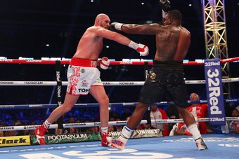 LONDON, ENGLAND - APRIL 23: Tyson Fury punches Dillian Whyte during the WBC World Heavyweight Title Fight between Tyson Fury and Dillian Whyte at Wembley Stadium on April 23, 2022 in London, England. (Photo by Julian Finney/Getty Images)