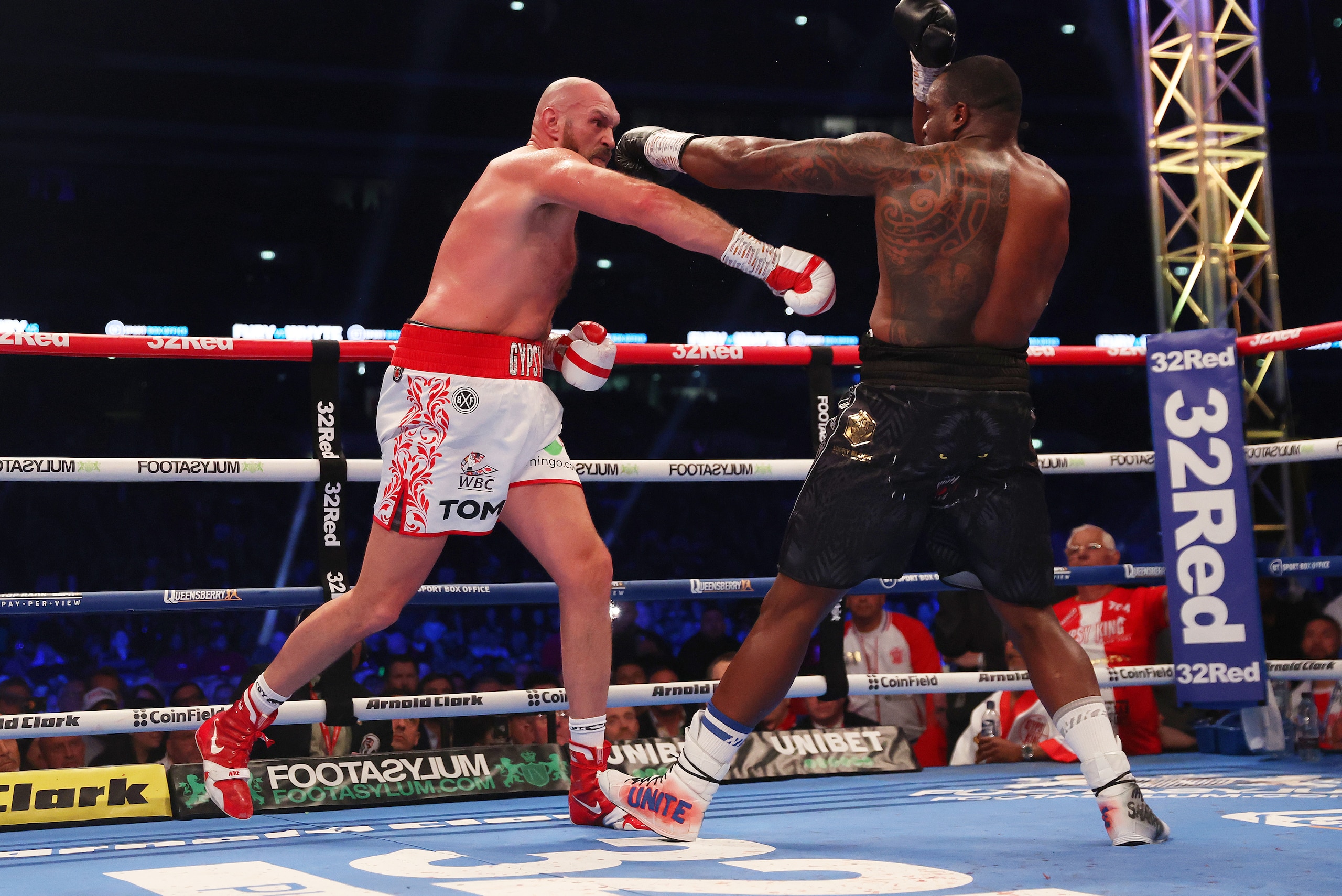 LONDON, ENGLAND - APRIL 23: Tyson Fury punches Dillian Whyte during the WBC World Heavyweight Title Fight between Tyson Fury and Dillian Whyte at Wembley Stadium on April 23, 2022 in London, England. (Photo by Julian Finney/Getty Images)