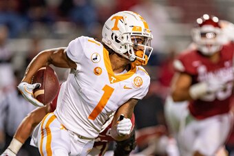 FAYETTEVILLE, AR - NOVEMBER 7:  Velus Jones Jr. #1 of the Tennessee Volunteers runs the ball during a game against the Arkansas Razorbacks at Razorback Stadium on November 7, 2020 in Fayetteville, Arkansas.  The Razorbacks defeated the Volunteers 24-13.  
