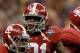 NEW ORLEANS, LA - JANUARY 09: Dre Kirkpatrick #21, Christion Jones #22, and Nico Johnson #35 of the Alabama Crimson Tide reacts after a defensive stop against the Louisiana State University Tigers during the 2012 Allstate BCS National Championship Game at Mercedes-Benz Superdome on January 9, 2012 in New Orleans, Louisiana. (Photo by Ronald Martinez/Getty Images)
