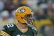 GREEN BAY, WI - DECEMBER 11: Aaron Rodgers #12 of the Green Bay Packers looks for a receiver against the Oakland Raiders at Lambeau Field on December 11, 2011 in Green Bay, Wisconsin. The Packers defeated the Raiders 46-16. (Photo by Jonathan Daniel/Getty Images)