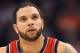 PHOENIX, AZ - JANUARY 13: Deron Williams #8 of the New Jersey Nets in action during the NBA game against the Phoenix Suns at US Airways Center on January 13, 2012 in Phoenix, Arizona. The Nets defeated the Suns 110-103. NOTE TO USER: User expressly acknowledges and agrees that, by downloading and or using this photograph, User is consenting to the terms and conditions of the Getty Images License Agreement. (Photo by Christian Petersen/Getty Images)