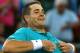 MELBOURNE, AUSTRALIA - JANUARY 18: John Isner of the USA celebrates after winning his second round match against David Nalbandian of Argentina during day three of the 2012 Australian Open at Melbourne Park on January 18, 2012 in Melbourne, Australia. (Photo by Mark Dadswell/Getty Images)