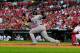ST. LOUIS, MO - AUGUST 14: Troy Tulowitzki #2 of the Colorado Rockies follows through on a one-run single against the St. Louis Cardinals at Busch Stadium on August 14, 2011 in St. Louis, Missouri. (Photo by Jeff Curry/Getty Images)