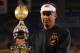 GLENDALE, AZ - JANUARY 02: Head coach Mike Gundy of the Oklahoma State Cowboys celebrates with the trophy after the Oklahoma State Cowboys won 41-38 in overtime against the Stanford Cardinal during the Tostitos Fiesta Bowl on January 2, 2012 at University of Phoenix Stadium in Glendale, Arizona. (Photo by Doug Pensinger/Getty Images)