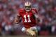 SAN FRANCISCO, CA - JANUARY 14: Alex Smith #11 of the San Francisco 49ers runs in for a touchdown in the fourth quarter against the New Orleans Saints during the NFC Divisional playoff game at Candlestick Park on January 14, 2012 in San Francisco, California. (Photo by Jed Jacobsohn/Getty Images)