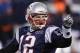 FOXBORO, MA - JANUARY 14: Tom Brady #12 of the New England Patriots reacts after he threw a 19-yard touchdown pass to Rob Gronkowski #87 in the second quarter against the Denver Broncos during their AFC Divisional Playoff Game at Gillette Stadium on January 14, 2012 in Foxboro, Massachusetts. (Photo by Elsa/Getty Images)