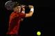 MELBOURNE, AUSTRALIA - JANUARY 21: Lleyton Hewitt of Australia plays a backhand in his third round match against Milos Raonic of Canada during day six of the 2012 Australian Open at Melbourne Park on January 21, 2012 in Melbourne, Australia. (Photo by Robert Prezioso/Getty Images)