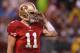 SAN FRANCISCO, CA - JANUARY 22: Alex Smith #11 of the San Francisco 49ers looks on during the NFC Championship Game against the New York Giants
at Candlestick Park on January 22, 2012 in San Francisco, California. (Photo by Ezra Shaw/Getty Images)