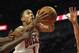 CHICAGO, IL - JANUARY 23: Derrick Rose #1 of the Chicago Bulls drives to the basket between (L-R) Anthony Morrow #22, Shawne Williams #7 and Kris Humphries #43 of the New Jersey Nets at the United Center on January 23, 2012 in Chicago, Illinois. The Bulls defeated the Nets 110-95. NOTE TO USER: User expressly acknowledges and agrees that, by downloading and or using this photograph, User is consenting to the terms and conditions of the Getty Images License Agreement. (Photo by Jonathan Daniel/Getty Images)