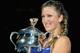 MELBOURNE, AUSTRALIA - JANUARY 28: Victoria Azarenka of Belarus poses with the Daphne Akhurst Memorial Cup after winning her women's final match against Maria Sharapova of Russia, and being named world number one, during day thirteen of the 2012 Australian Open at Melbourne Park on January 28, 2012 in Melbourne, Australia. (Photo by Lucas Dawson/Getty Images)