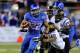 LAS VEGAS, NV - DECEMBER 22: Doug Martin #22 of the Boise State Broncos runs for yardage ahaead of Keelan Johnson #10 of the Arizona State Sun Devils during the MAACO Bowl Las Vegas at Sam Boyd Stadium December 22, 2011 in Las Vegas, Nevada. Boise State won 56-24. (Photo by Ethan Miller/Getty Images)