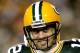 GREEN BAY, WI - DECEMBER 25: Quarterback Aaron Rodgers #12 of the Green Bay Packers smiles as he leaves the field after a touchdown in the fourth quarter against the Chicago Bears at Lambeau Field on December 25, 2011 in Green Bay, Wisconsin. (Photo by Matthew Stockman/Getty Images)