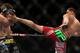 Nick Diaz (right) kicks Carlos Condit during the UFC 143 event at Mandalay Bay Events Center on February 4, 2012 in Las Vegas, Nevada. (Photo by Josh Hedges/Zuffa LLC/Zuffa LLC via Getty Images)