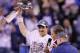 INDIANAPOLIS, IN - FEBRUARY 05: Quarterback Eli Manning #10 of the New York Giants poses with the Vince Lombardi Trophy after the Giants defeated the Patriots by a score of 21-17 in Super Bowl XLVI at Lucas Oil Stadium on February 5, 2012 in Indianapolis, Indiana. (Photo by Jeff Gross/Getty Images)