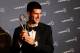 LONDON, ENGLAND - FEBRUARY 06: Tennis Player Novak Djokovic poses with his Laureus World Sportsman of the Year trophy in the press room at the 2012 Laureus World Sports Awards at Queen Elizabeth II Conference Centre on February 6, 2012 in London, England. (Photo by Tom Dulat/Getty Images for Laureus)