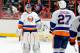 WASHINGTON, DC - JANUARY 17: Evgeni Nabokov #20 of the New York Islanders is congratulated by teammates after a 3-0 victory against the Washington Capitals at the Verizon Center on January 17, 2012 in Washington, DC. (Photo by Greg Fiume/Getty Images)
