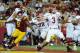 LOS ANGELES, CA - SEPTEMBER 10: Jordan Wynn #3 of the Utah Utes passes as he is rushed by Nick Perry #8 of the USC Trojans while blocked by John Cullen #77 of the Utah Utes during the game at Los Angeles Memorial Coliseum on September 10, 2011 in Los Angeles, California. (Photo by Harry How/Getty Images)