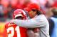 KANSAS CITY, MO - JANUARY 09: Head coach Todd Haley of the Kansas City Chiefs hugs cornerback Javier Arenas #21 prior to the 2011 AFC wild card playoff game against the Baltimore Ravens at Arrowhead Stadium on January 9, 2011 in Kansas City, Missouri. (Photo by Dilip Vishwanat/Getty Images)